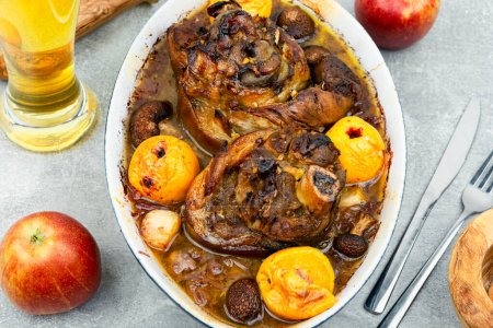 Photo for Roasted pork knuckle eisbein with cabbage and apples. Pork leg, German food - Royalty Free Image