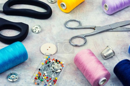 Photo for Home sewing kit, scissors, pin, buttons and colorful thread. Needlework concept - Royalty Free Image