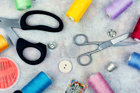 Photo for Set sewing kit, scissors, threads, needles and colorful thread. Needlework concept. Top view, flat lay - Royalty Free Image