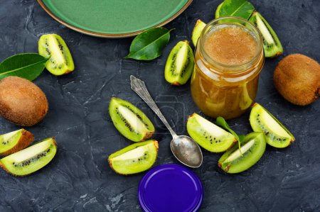 Photo for Homemade kiwi jam jar with raw fruit ,jam kiwi in a glass jar - Royalty Free Image