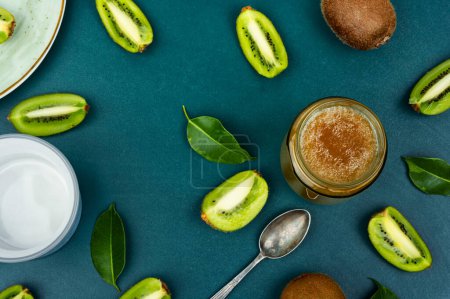 Photo for Delicious kiwi jam in a glass jar. Top view - Royalty Free Image