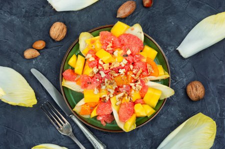 Photo for Delicious salad of grapefruit, mango and chicory. Healthy food - Royalty Free Image