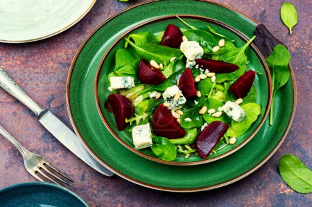Photo for Spring or summer salad with beetroot, cheese, herbs and pine nuts. Diet detox raw food - Royalty Free Image