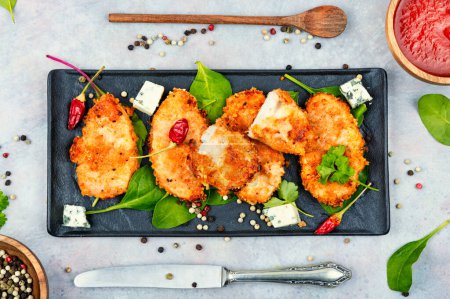 Photo for Baked spicy juicy chicken breasts in breadcrumbs, chicken meat. - Royalty Free Image