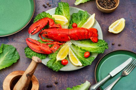 Téléchargez les photos : Boiled lobster with greens and lemon on a plate. Seafood - en image libre de droit