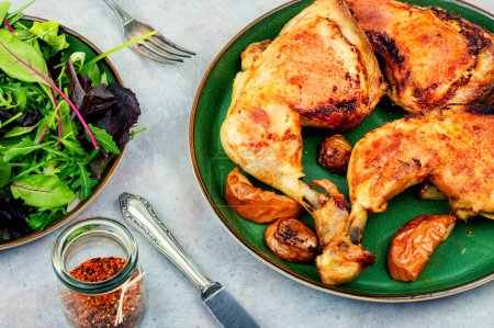 Photo for Tasty barbecue chicken drumstick and fresh green salad. Chicken legs quarters - Royalty Free Image