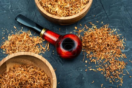 Photo for Smoking tobacco and classic wooden smoking pipe on the table for man - Royalty Free Image