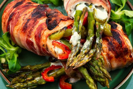 Photo for Meatloaf wrapped in bacon. Meat stuffed with asparagus and cheese. Close up. - Royalty Free Image