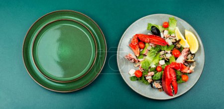 Photo for Appetizing salad of oysters, mussels, lobster and vegetables. - Royalty Free Image