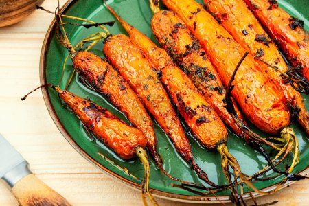 Photo for Fried carrots with herbs and spices on the plate - Royalty Free Image
