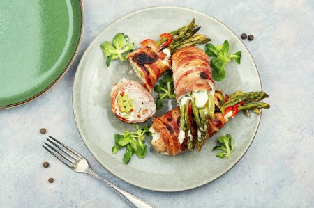 Photo for Roasted green asparagus wrapped with meat . Top view - Royalty Free Image