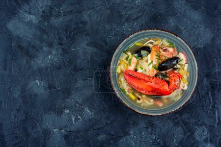 Photo for Fresh soup with lobster, mussels, shrimps and fish. Seafood soup. Space for text - Royalty Free Image