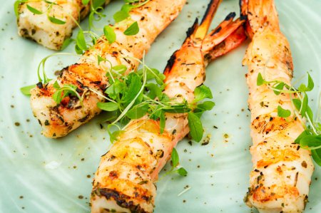 Photo for Tiger shrimp barbecue with herbs grilled on wooden sticks. - Royalty Free Image