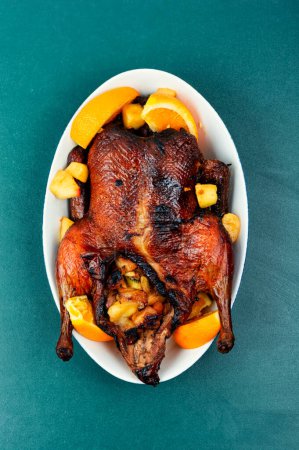 Photo for Whole duck baked with oranges and caramelized apples. - Royalty Free Image
