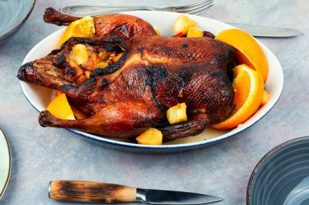 Photo for Roast duck with orange and caramelized apples in tray. - Royalty Free Image