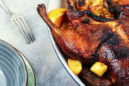 Photo for Tasty duck baked with oranges and caramelized apples. Traditional holiday dish - Royalty Free Image
