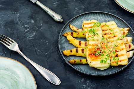 Photo for White asparagus, halloumi cheese decorated with sesame seeds. Ketogenic diet - Royalty Free Image