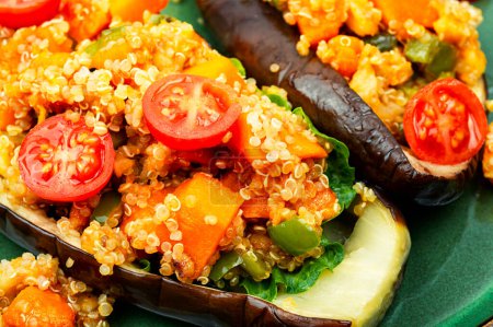 Photo for Eggplant stuffed with pumpkin, quinoa and tomato. - Royalty Free Image