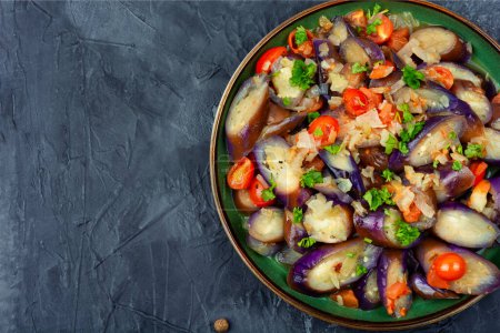 Photo for Warm purple eggplant, tomato and garlic salad. Copy space for text - Royalty Free Image