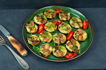 Photo for Diet food-baked slices zucchini with mushrooms and herbs. - Royalty Free Image
