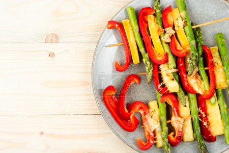 Photo for Diet skewers of asparagus, peppers and cheese. Grilled skewers vegetables. Copy space. - Royalty Free Image