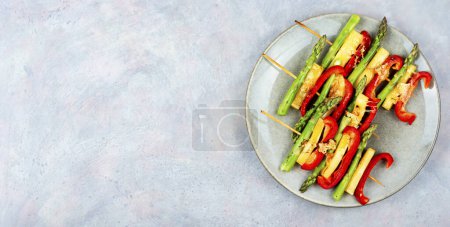 Photo for Shish kebabs with bell peppers, green asparagus, halloumi cheese. Copy space. - Royalty Free Image