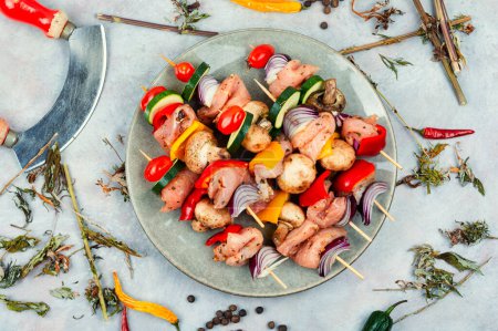Photo for Skewers with raw meat marinated in herbs. Raw marinated and spicy meat skewers - Royalty Free Image