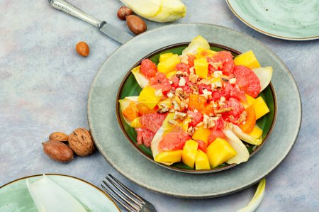 Photo for Delicious vitamin salad of grapefruit, mango and chicory. Concept for healthy vegetarian meal - Royalty Free Image