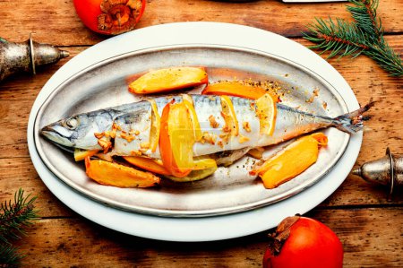 Photo for Fish cooked in persimmon fruit marinade. Healthy seafood, top view. - Royalty Free Image