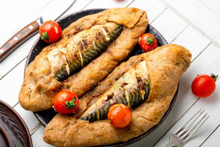 Photo for Delicious fish pie with mackerel.Roasted fillets of mackerel fish in bread. - Royalty Free Image