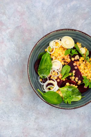 Photo for Salad with beets,red lentils, onions and herbs in bowl. Healthy eating. Flat lay - Royalty Free Image