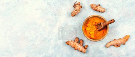 Photo for Pile of turmeric root and turmeric powder. Copy space. Medicinal herb - Royalty Free Image