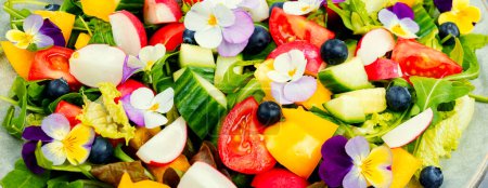 Photo for Bright vegan salad with edible flowers. Clean eating. - Royalty Free Image