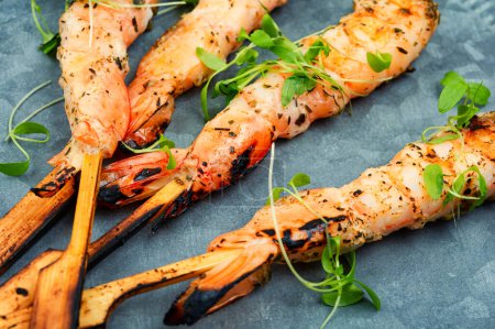 Photo for Roasted peeled prawn with skewer. Tasty shrimp barbecue. BBQ - Royalty Free Image