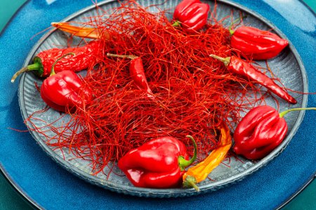 Photo for Spicy seasoning, spice, cut from red pepper. Thinly sliced pepper. - Royalty Free Image