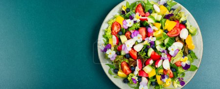 Photo for Bright vegetable salad with edible flowers. Copy space. - Royalty Free Image