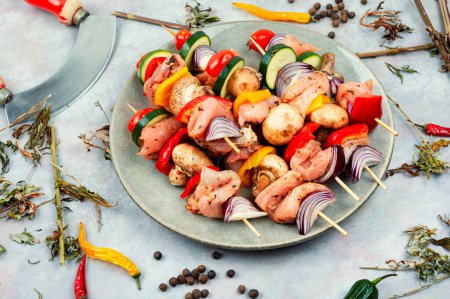 Photo for Skewers with pieces of raw meat and vegetables marinated in herbs. - Royalty Free Image