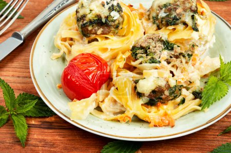 Photo for Nests of noodles with meatballs and nettles. Keto dish. - Royalty Free Image