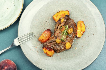 Photo for Grilled beef meat steak with peach in fruit marinade. Barbecue - Royalty Free Image