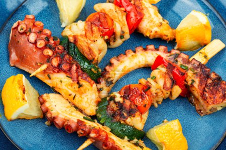 Photo for Seafood skewer. Grilled octopus or squid on a skewer - Royalty Free Image
