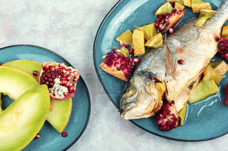 Photo for Baked dorado fish or gilt-head bream with melon. Healthy food - Royalty Free Image
