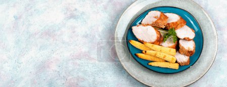 Photo for Sliced pork tenderloin grilled with baked corn. Copy space - Royalty Free Image
