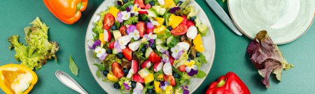 Photo for Spring salad with vegetable and edible flowers violets. Clean eating. - Royalty Free Image