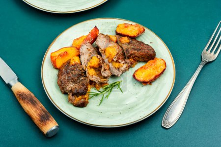 Photo for Diet baked beef steak with peach. American cuisine. - Royalty Free Image