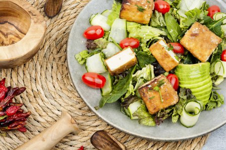 Photo for Unusual salad with fried tofu, vegetables and herbs - Royalty Free Image