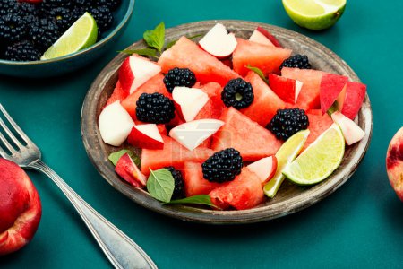 Photo for Fresh juicy salad of watermelon, blackberry and peach. Summer fruit diet salad. - Royalty Free Image
