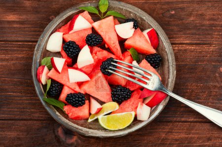 Photo for Juicy salad of watermelon, blackberry and peach. Healthy summer dessert - Royalty Free Image