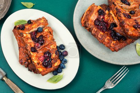 Photo for Delicious fried pork ribs with blueberry sauce - Royalty Free Image