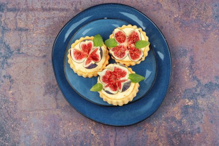 Photo for Tartlets with cream and figs. Sweet tartlets with fresh berries. - Royalty Free Image