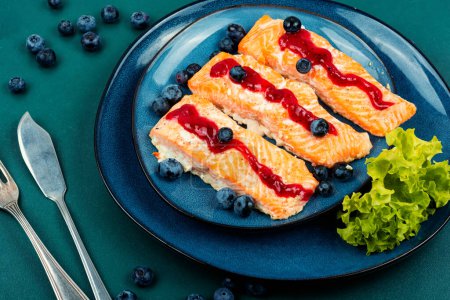Photo for Fried tasty salmon fillet with blueberry berry sauce. Healthy food - Royalty Free Image